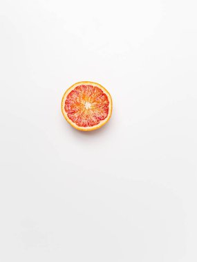 Red blood orange fruit with slices isolated on white background. Whole ripe juicy Sicilian Blood oranges. Selective focus. Isolated. Clipping path.