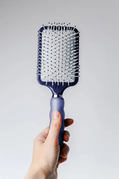 Blue Hair Comb Hand White Light Gray Background Isolated Copy Stok Foto