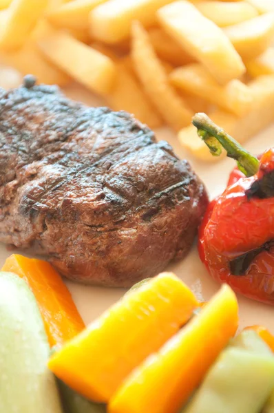 Grilled steak with patties — Stock Photo, Image