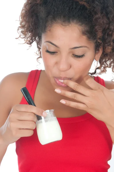 Chica comiendo un yogur — Foto de Stock