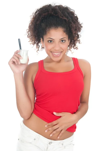 Girl eating a yoghurt — Stock Photo, Image