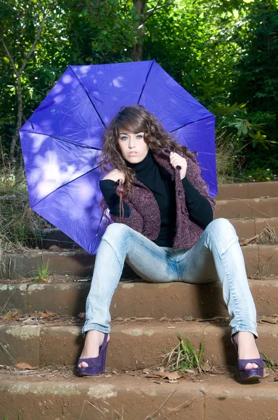 Woman at the forest in winter with umbrella — Stock Photo, Image