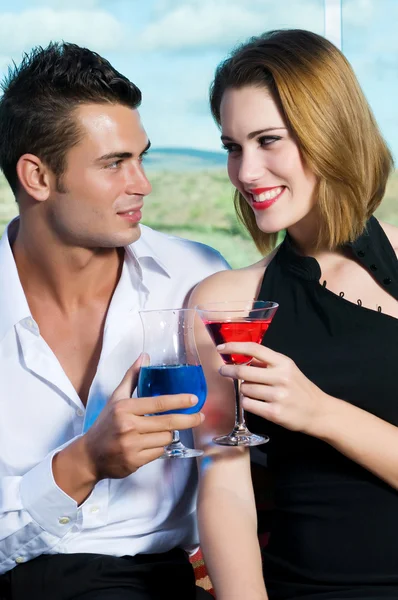 Beautiful couple having a drink — Stock Photo, Image