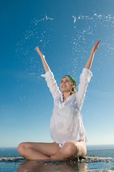 Woman playing with water Royalty Free Stock Photos