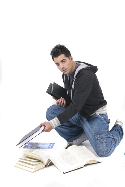 Joven con muchos libros — Foto de Stock