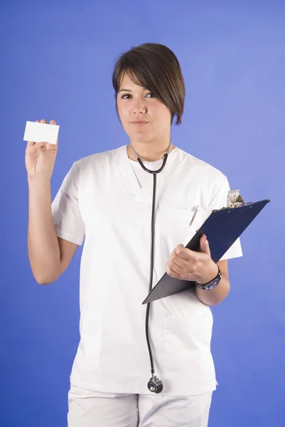 Doctor with stethoscope and white card — Stock Photo, Image