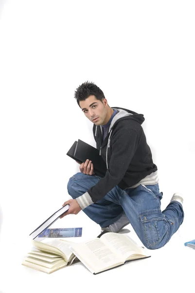 Joven con muchos libros — Foto de Stock