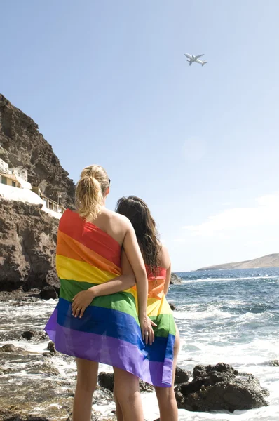 Couple of women in love with lesbian rainbow flat — Stock Photo, Image