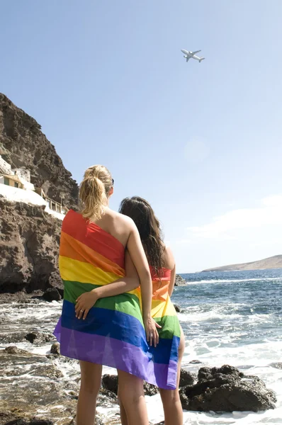 Couple of women in love with lesbian rainbow flat — Stock Photo, Image