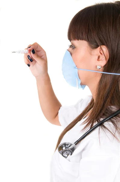 Doctor with thermometer and protective mask — Stock Photo, Image