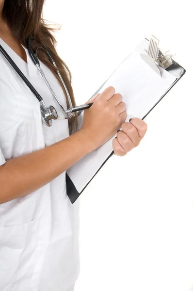 Lekarz z stetoskop pisania — Zdjęcie stockowe