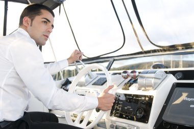 Man at yatch control clipart
