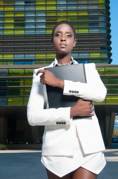 Business woman in financial street — Stock Photo, Image