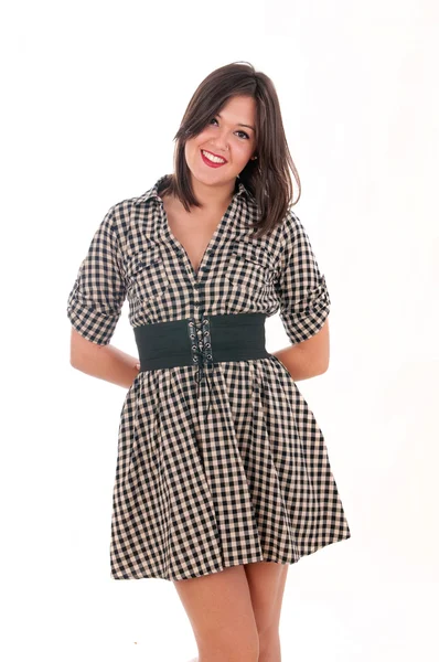 Meisje in een geruite jurk — Stockfoto