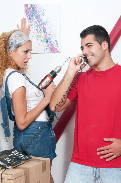 Couple working in their new home — Stock Photo, Image