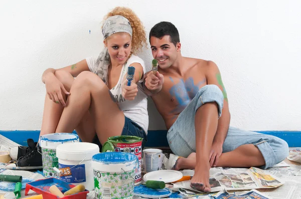Couple tired after painting at home — Stock Photo, Image