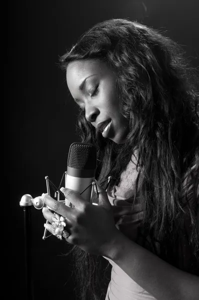 Black woman singer in the recording studio