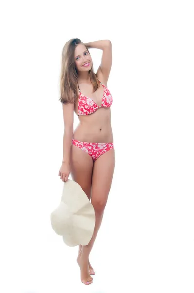 Beautiful woman in bikini holding big hat — Stock Photo, Image