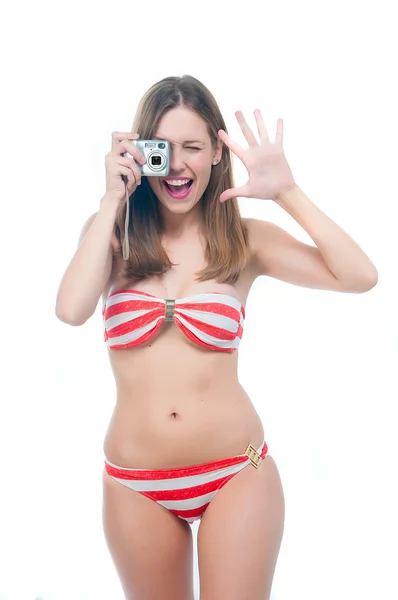 Beautiful woman in bikini making photo on the camera — Stock Photo, Image
