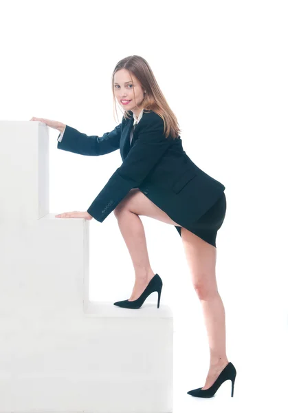 Business woman stepping up on stairs — Stock Photo, Image