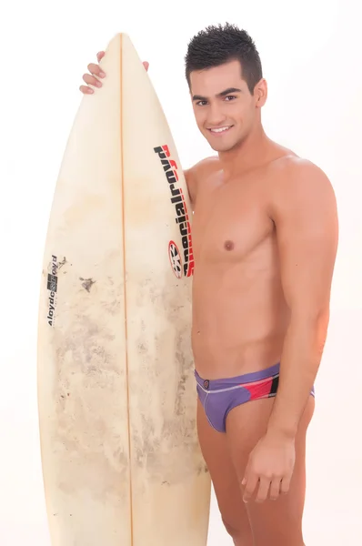 Man wearing swimsuit with surfboard — Stock Photo, Image