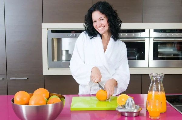 Happy woman with orange juice — Stock Photo, Image