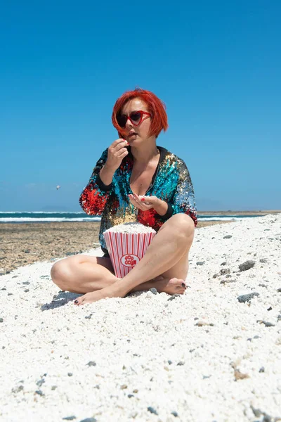 woman in the sun on the sand of Popcorn Beach in Fuerteventura