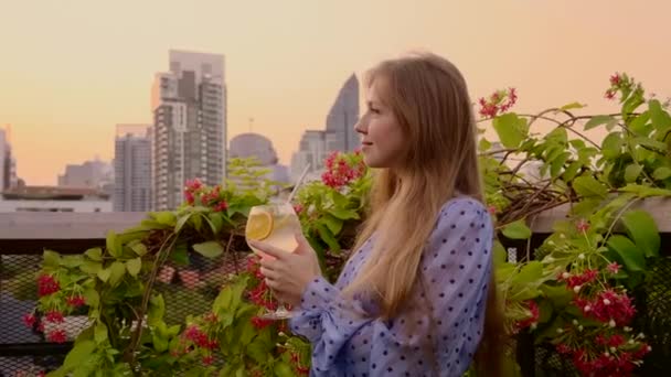 Happy Attractive Woman on Rooftop Garden with Glass of Non-alcoholic Cocktail — Stock Video