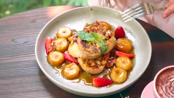 Woman Hand Take a Strawberry from Plate with Banana French Toast Bread — Stock Video