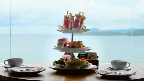 Afternoon Tea Stand Assortment Sweets Cakes Sandwiches Fruit Canapes Table — Stock Video