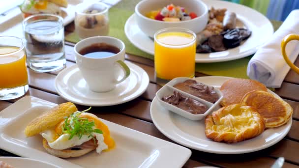 Delicious Breakfast Hotel Table Various Food Eggs Benedict Fresh Pastry — Stockvideo