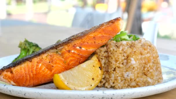 Close Fried Salmon Steak Vegetables Lemon Rice White Plate Healthy — Stok Video