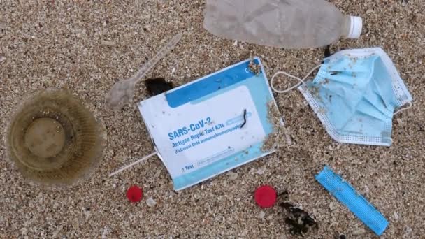 Plastic Bottle Trash Face Mask Covid Test Sandy Sea Beach — Stok video