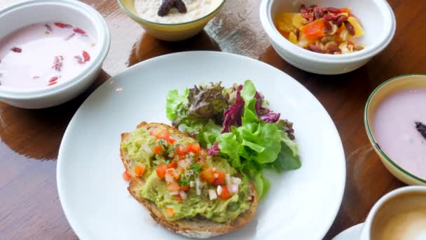 Healthy Breakfast Avocado Toast Muesli Fresh Berries Yogurt Cup Coffee — Vídeos de Stock