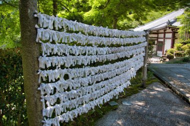 A fence for tying the fortune slips onto it.  Kyoto Japan  