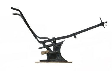 Old manual plow isolated over white clipart