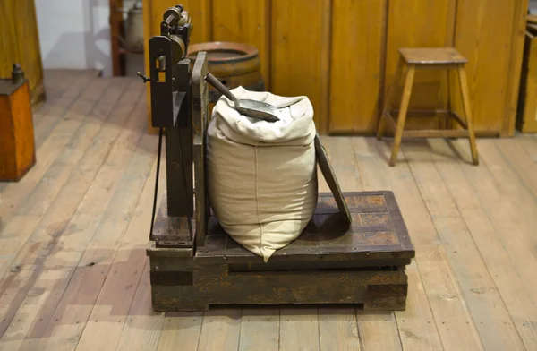 Antique scale with sack — Stock Photo, Image