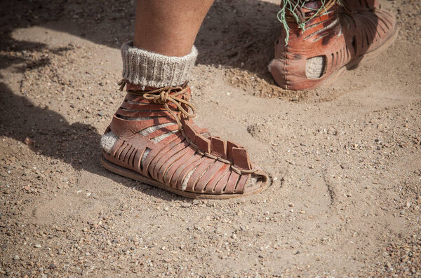 Roman legionary foot-soldier wearing caliga. Soldier wears additional woven socks for winter campaigns