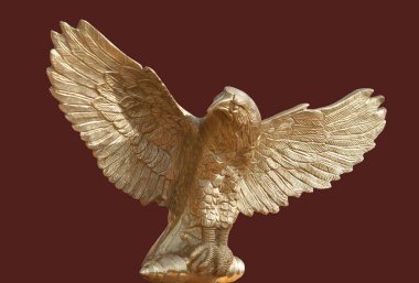 Aquila, eagle item used in ancient Rome as standard of a legion. Isolated over red background