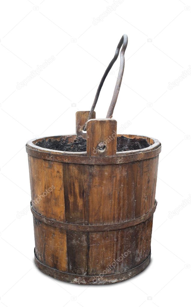 Old wooden wishing well. Item waterproofing with pitch. Isolated