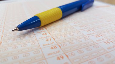 Ballpen over public service multiple-choice test. Public examination concept