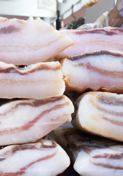 Iberian salt-cured pork fat. Pieces displayed at street market stall