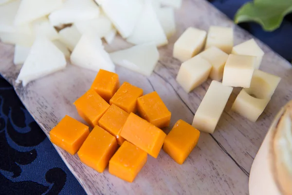 Cubes Cheese White Wooden Cutting Board Closeup — ストック写真