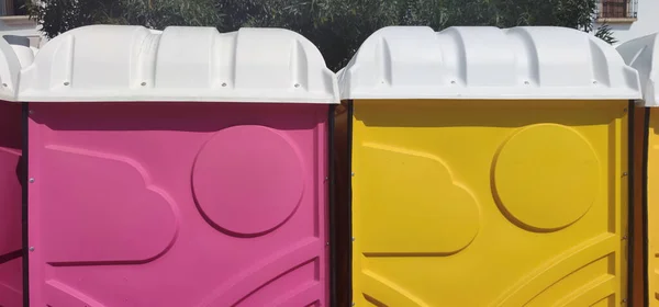 Pink Yellow Portable Toilets Outdoors Shot — Zdjęcie stockowe