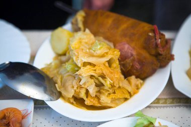 Botillo with tender cabbage, culinary specialty of El Bierzo, Leon, Spain. Selective focus