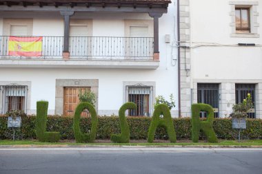 Welcoming green letters sculpture at Losar de la Vera, Caceres, Extremadura, Spain