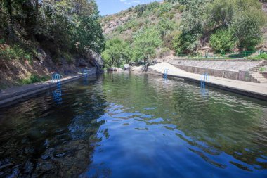 Vadillo Natural swimming pool. Crystal-clear waters spot in the heart of La Vera County. Losar de la Vera, Caceres, Extremadura, Spain