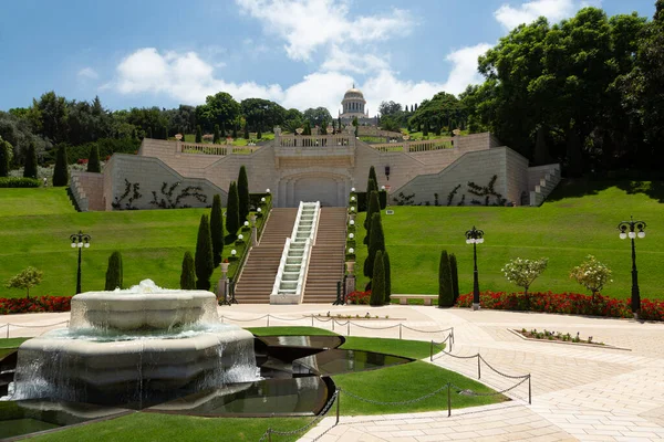 Blooming Bahai garden with fountains and vegetation