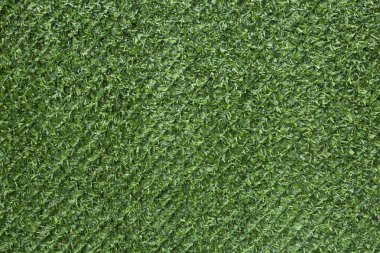 Yapay yeşil çimenden yapılmış yeşil çit.