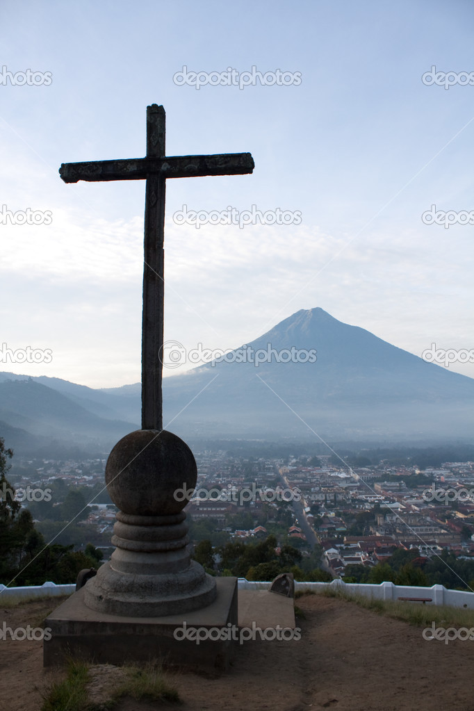 Cross and volcano over Antigua Guatemala valley